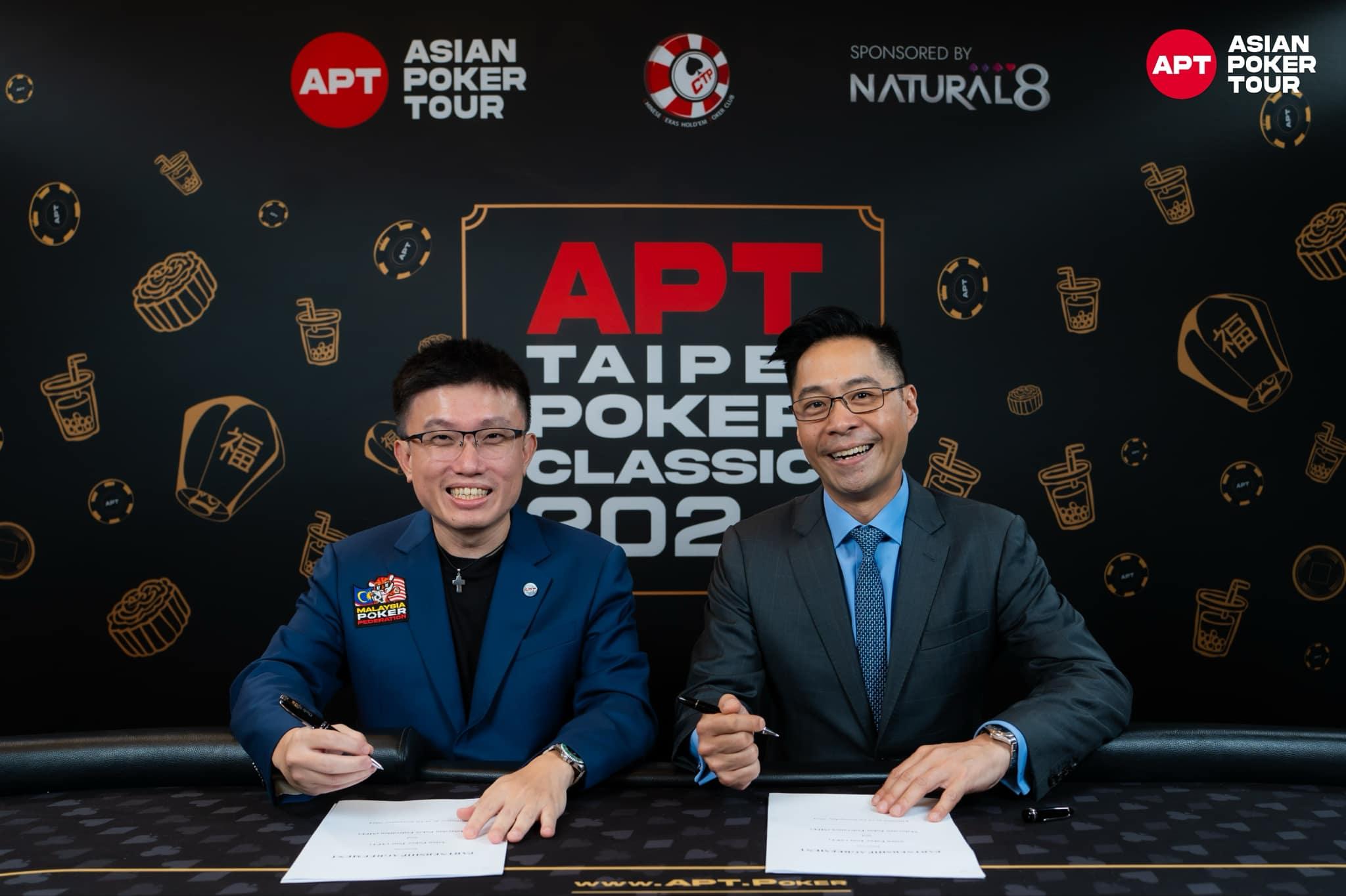 2 men signing agreement